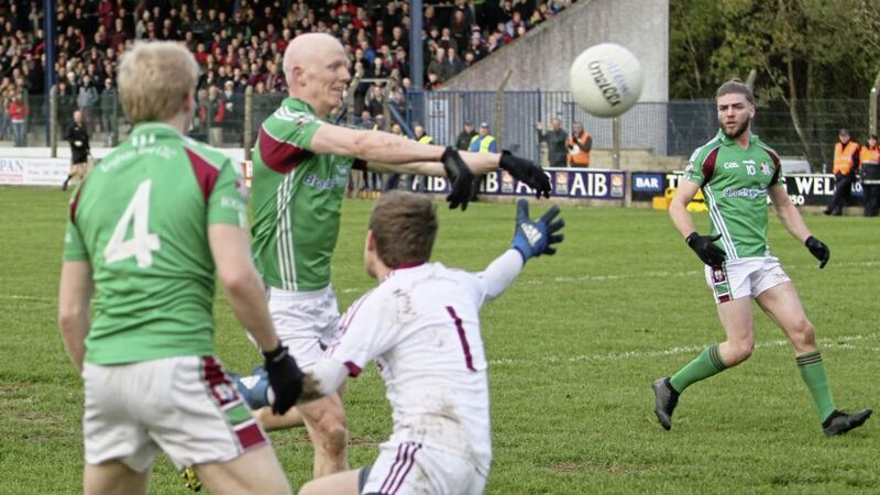Colm McGoldrick sends the ball to the back of the Castlerahan net in the Ulster quarter-final. Photo: Adrian Donohoe. 