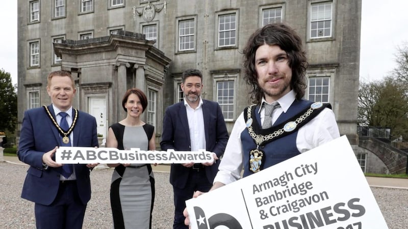 Announcing the finalists in the Armagh City, Banbridge &amp; Craigavon Borough Council business awards are (from left) deputy lord mayor Paul Greenfield, Kerry Lyle of event sponsor Almac, event host Jim Fitzpatrick and lord mayor Garath Keating 