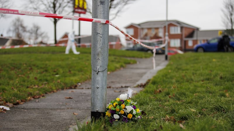 Floral tributes have been left in Edward Street, Lurgan, in recent days (Liam McBurney/PA)