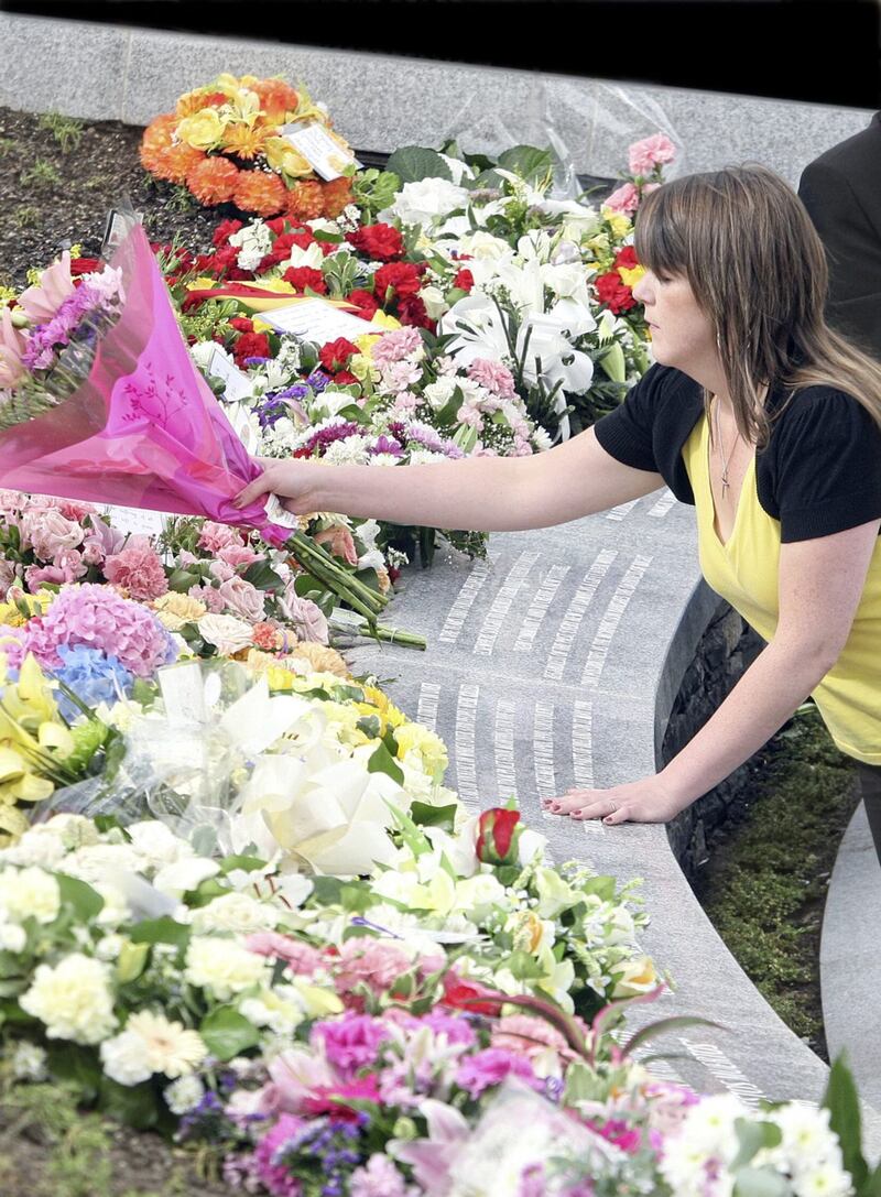 Laying flowers during the Omagh Bomb rememberance ceremony in the Garden of Light. Picture by Colm O'Reilly 17-08-08