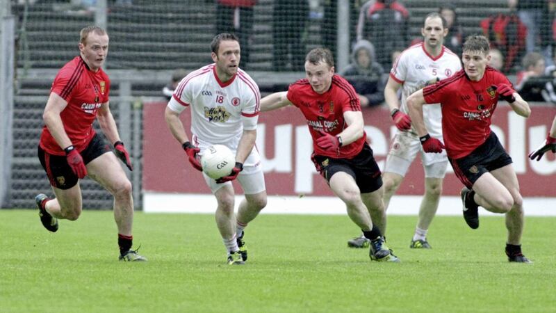 Former Down forward Benny Coulter (left) would love to see Down go all out for victory against Cork at Pairc Ui Rinn on Sunday 