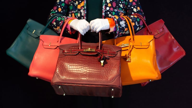 Rare Hermes Birkin bags can fetch six figures at auction (Alamy/PA)
