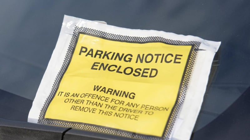 A parking ticket on a car windscreen 