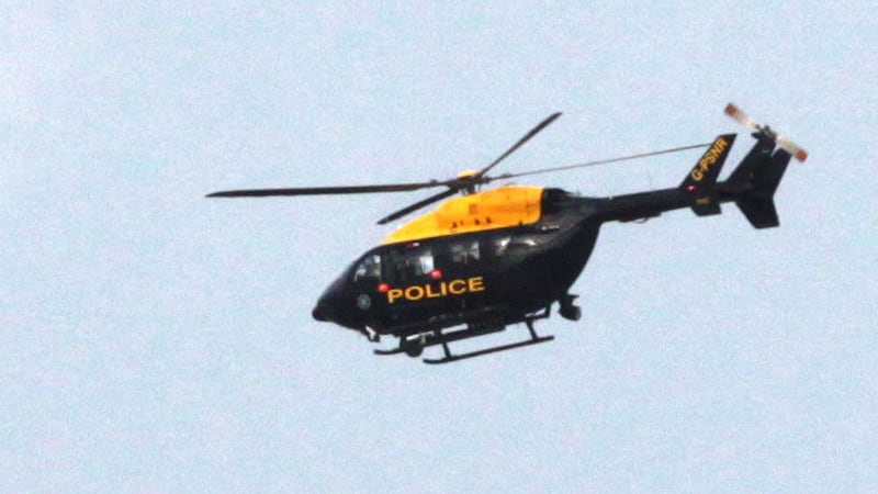 A police helicopter over Drumsurn, near Dungiven, during the security alert on Friday. Picture by Margaret McLaughlin 