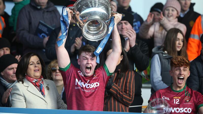 FIRST CLASS: Jamie&nbsp;Haughey, captain of St&nbsp;Ronan&rsquo;s College, Lurgan,&nbsp;lifts the MacRory&nbsp;Cup after his side&rsquo;s&nbsp;victory over St Mary&rsquo;s,&nbsp;Magherafelt, in Armagh&nbsp;yesterday. Pictured&nbsp;on right is man of the&nbsp;match Rioghan Meehan.&nbsp;It was the first MacRory&nbsp;Cup win in the school&rsquo;s&nbsp;short history.&nbsp;Picture: Hugh Russell&nbsp;
