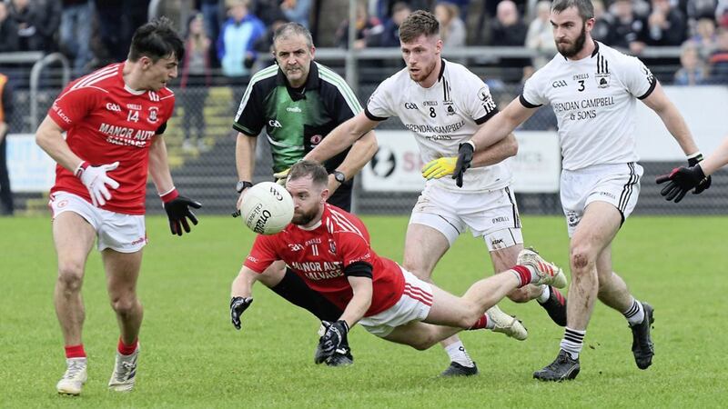 We&#39;ll meet again. A diving Niall Donnelly gets the ball away to Lee Brennan watched by Clonoe&#39;s Declan McClure and Paul O&#39;Neill. Trillick and Clonoe meet again tomorrow. 