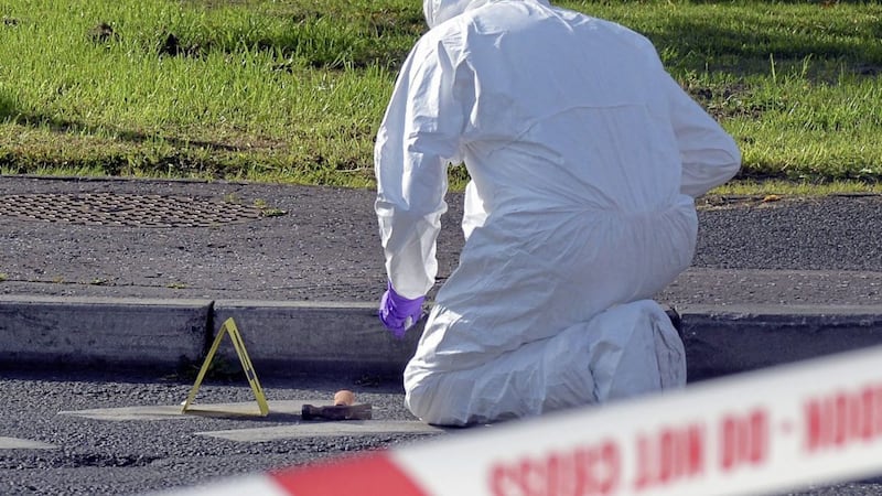 A hammer is examined by forensic investigators. Picture by Tony Hendron 