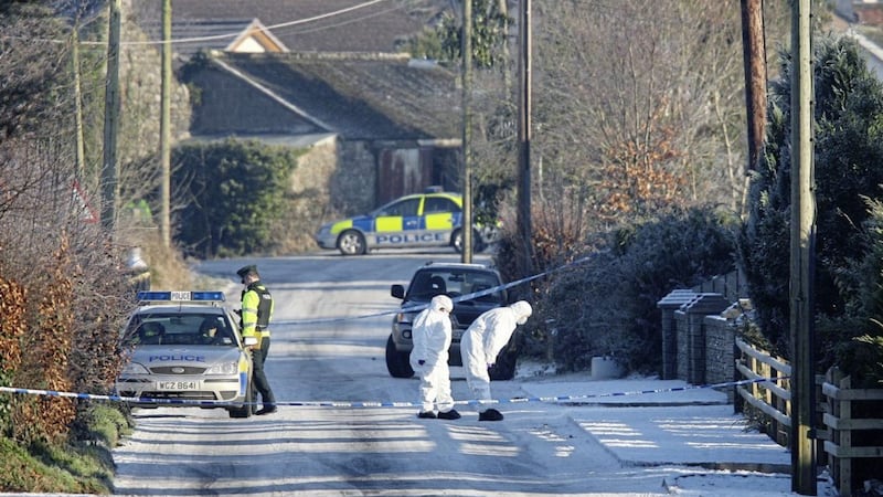 Forensic officers at the scene of the attack on Peadar Heffron at Milltown Road in Randalstown in 2010. 