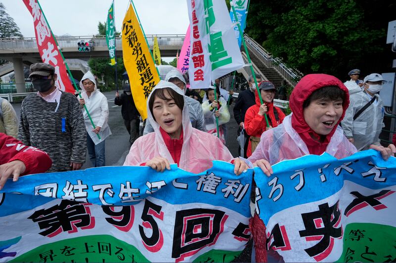A May Day rally in Tokyo called for salary increases to offset rising prices (Hiro Komae/AP)