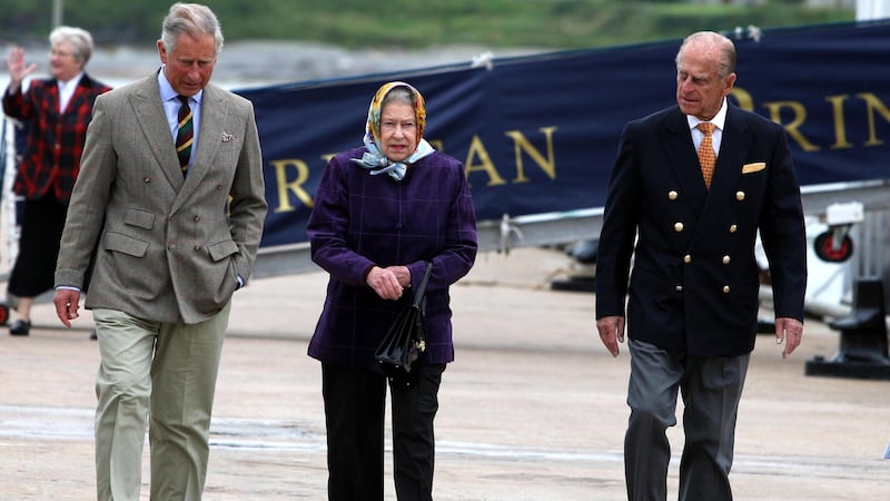 Queen Elizabeth II with the Duke of Edinburgh and the then Prince of Wales in 2010 (Andrew Milligan/PA)