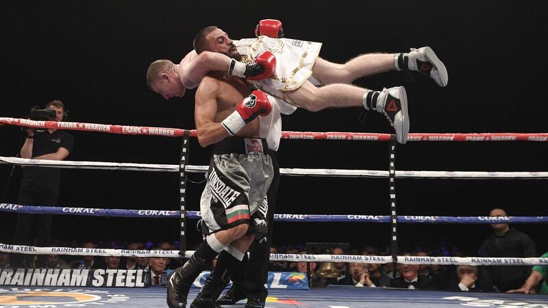 Paddy Barnes is lifted by Stefan Slavchev during Saturday's fight at Titanic Belfast<br />Picture by Pacemaker