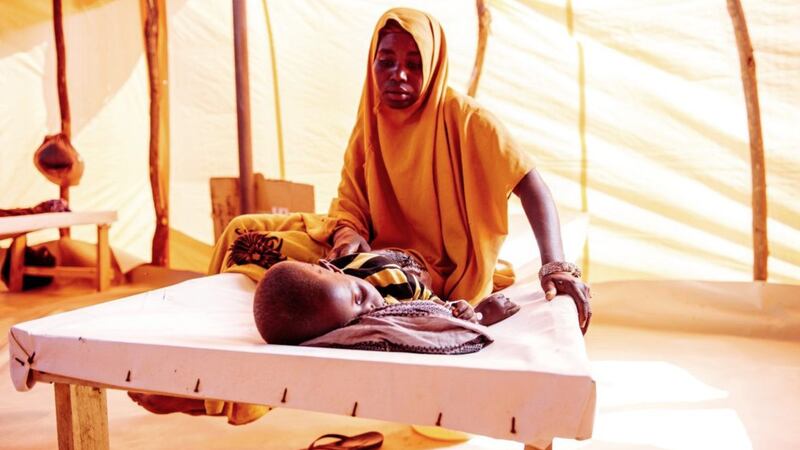 Zeinab Odowa Colow watches over her dehydrated son, four-year-old Osman, at Tr&oacute;caire&#39;s Dollow Cholera Treatment Centre in Somalia. Picture by Amunga Eshuchi 