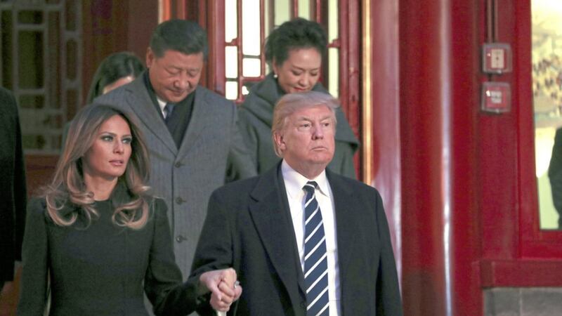 President Donald Trump and first lady Melania Trump arrive with Chinese President Xi Jinping (back, left) and his wife Peng Liyuan for an opera performance at the Forbidden City during a trip to Asia in 2017 