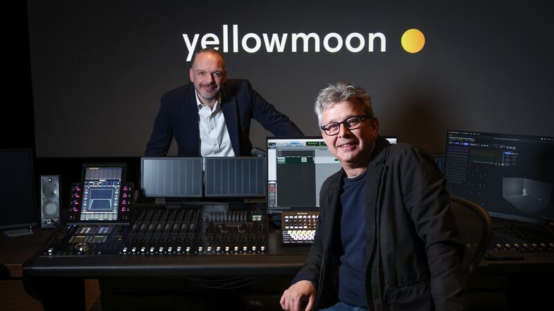 Yellow Moon’s Greg Darby (seated), in the firm’s upgraded Holywood studios with Bank of Ireland UK business manager, Gareth Wilson (standing).