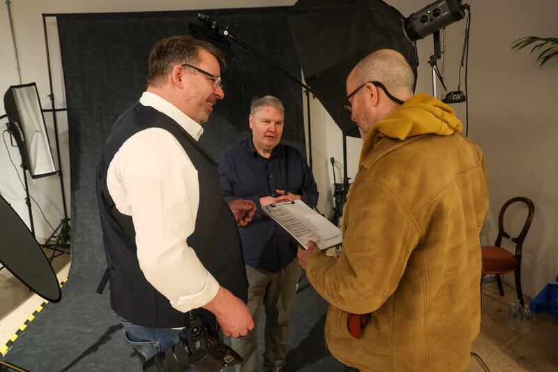 Stephen Bradley talks with photographers Gary and John before he poses for the Wallflower portrait Project in 2 Royal Avenue. PICTURE: MAL MCCANN