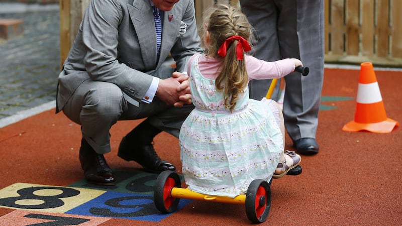 Prince Charles meets Rachel Lloyd (3), at the East Belfast Community Development Agency. Picture by Darren Staples, Press Association              