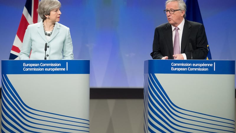<b>DEAL OR NO DEAL?:</b> British Prime Minister Theresa May and EU President Jean-Claude Juncker speaking after the Commission announced that &ldquo;sufficient progress&rdquo; has been made in the first phase of Brexit talks&nbsp;