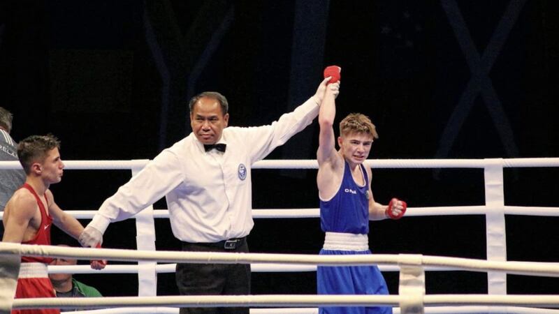 Jude Gallagher has his hand raised in victory after defeating Brazil&#39;s Rafael Bianchi in the quarter-final of the World Youth Championships on Saturday 