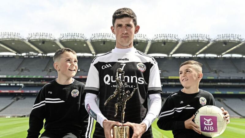 Kilcoo footballer Eugene Branagan with his AIB GAA club footballer of the year award and nephews Pat Branagan, aged 9, left, and Jonjo Branagan, aged 8, during the AIB GAA Club Players&rsquo; Awards 2021/22 at Croke Park in Dublin. Photo by Sam Barnes/Sportsfile 