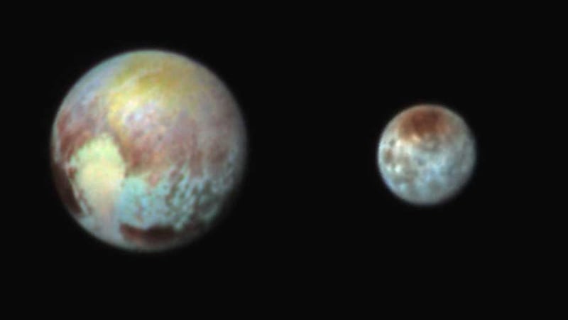 This Monday, July 13, 2015 combination image released by NASA shows Pluto, left, and its moon, Charon, with differences in surface material and features depicted in exaggerated colors made by using different filters on a camera aboard the New Horizons spacecraft. <br />In this composite false-color image, the apparent distance between the two bodies has also been reduced
