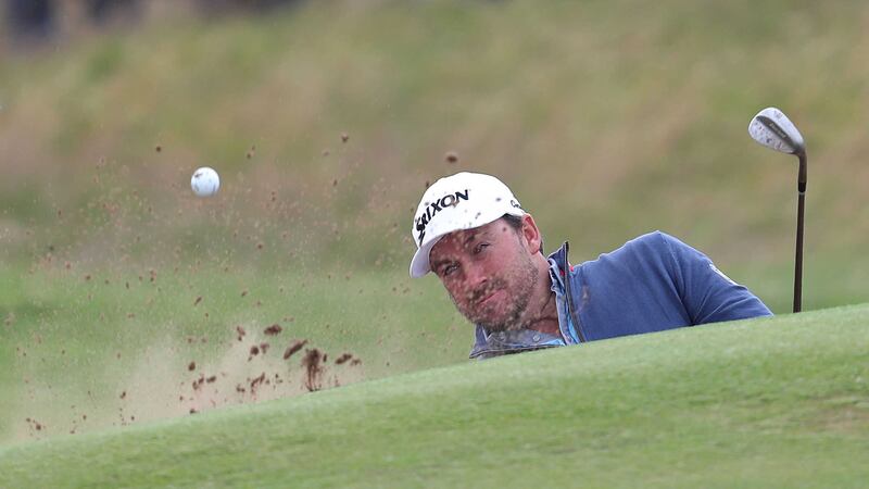 Graeme McDowell plays out of a bunker at Troon&nbsp;