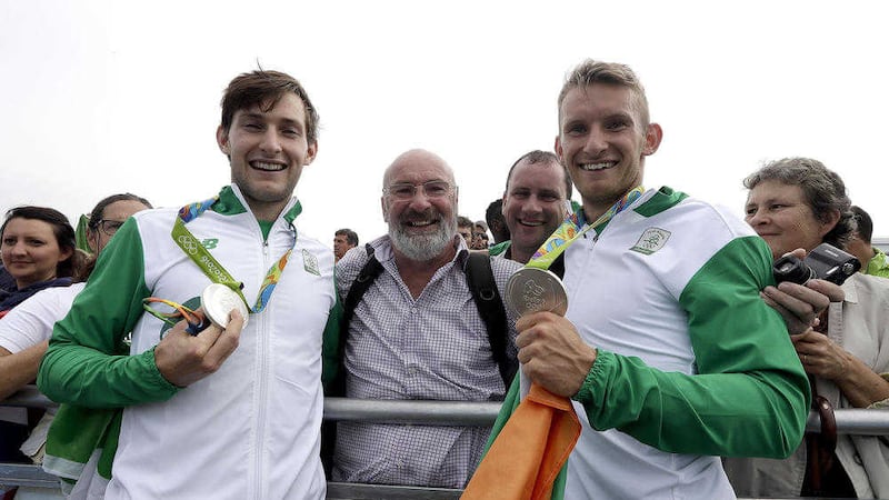 Gary O&#39;Donovan and Paul O&#39;Donovan, of Ireland, celebrate their silver medals in men&#39;s rowing lightweight double sculls final at the Rio Olympics. The brothers won Ireland&#39;s first medal at the games and the first ever in rowing. (AP Photo/Luca Bruno) 