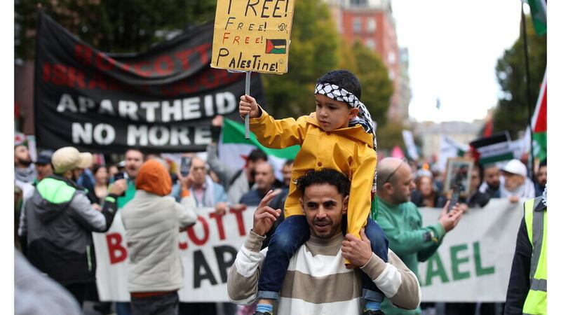 A man and a child at a pro-Palestinian protest in Belfast in October. Picture: Declan Roughan/Press Eye