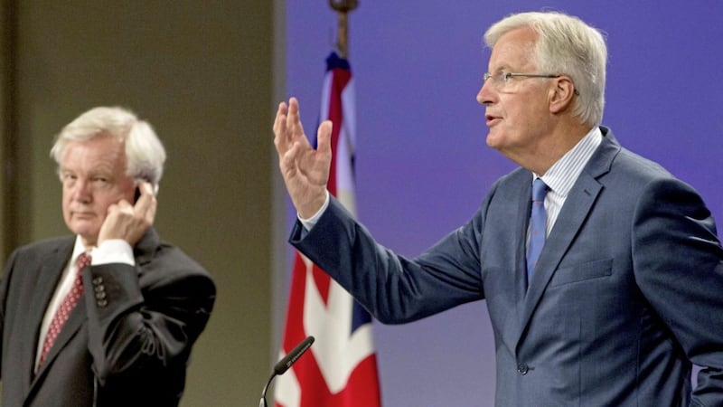 European Union chief Brexit negotiator Michel Barnier, right, at a media conference with British Secretary of State for Exiting the European Union David Davis at EU headquarters in Brussels. Picture by Virginia Mayo/AP 