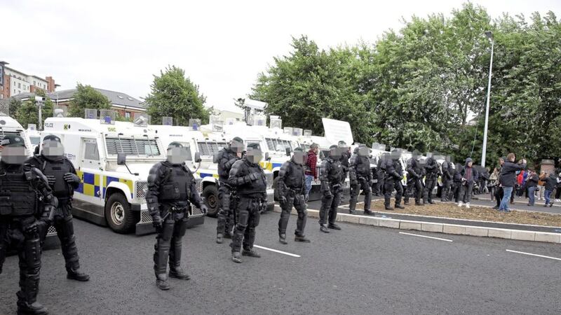 Police block the route of an anti-internment parade in west Belfast last year  