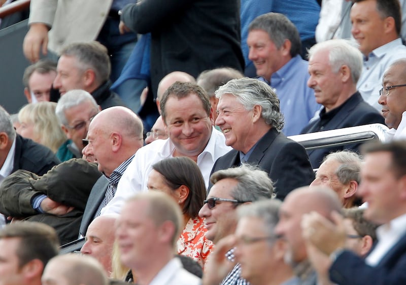 Joe Kinnear sits alongside Newcastle owner Mike Ashley during his time as the club’s director of football .