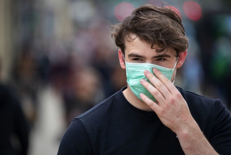 &nbsp;A shopper wearing a face mask. Picture from Jane Barlow, Press Association