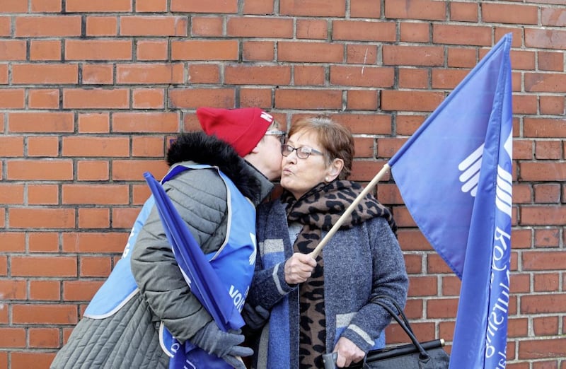Former patient Elizabeth Muldoon (right) stood on the picket line outside the Royal Victoria Hospital in support of striking nurses. Picture by Mal McCann 