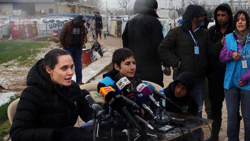 Actress Angelina Jolie with special envoy of the United Nations High Commissioner for Refugees, speaks during a press conference at a Syrian refugee camp, in the eastern city of Zahleh, Lebanon. Picture by Bilal Hussein, Associated Press