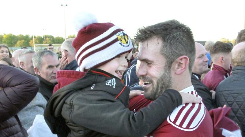 Former Derry and current Banagher star Mark Lynch with his son Paudie after the club won an intermediate championship in 2018. Mark was diagnosed with testicular cancer earlier this year at the age of 34, but has had successful treatment and is in remission. Picture by Margaret McLaughlin 