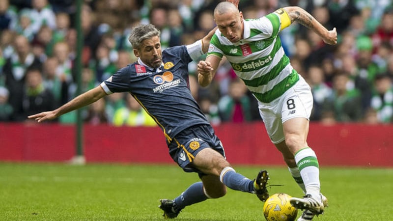 &nbsp;Motherwell's Keith Lasley and Celtic's Scott Brown battle for the ball in the Ladbrokes Scottish Premiership match at Celtic Park, Glasgow.