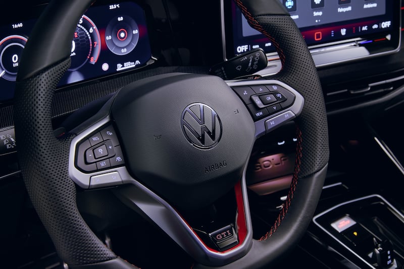 A photo showing the new Volkswagen Golf's steering wheel, which features the return of real buttons