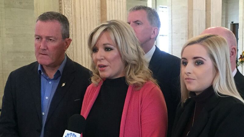 Sinn Fein's Michelle O'Neill addresses the media surrounded by party colleagues in the Great Hall of Parliament Buildings, Stormont&nbsp;