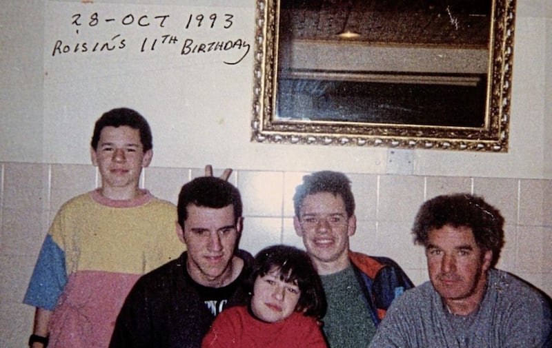 The last photograph taken of Gerard, second left, and Rory Cairns, second right, with their sister Roisin who was celebrating her 11th birthday on the night the brothers were shot dead by the UVF in their home. 
