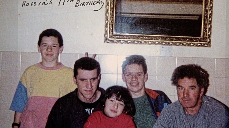 The last photograph taken of Gerard, second left, and Rory Cairns, second right, with their sister Roisin who was celebrating her 11th birthday on the night the brothers were shot dead by the UVF in their home. 