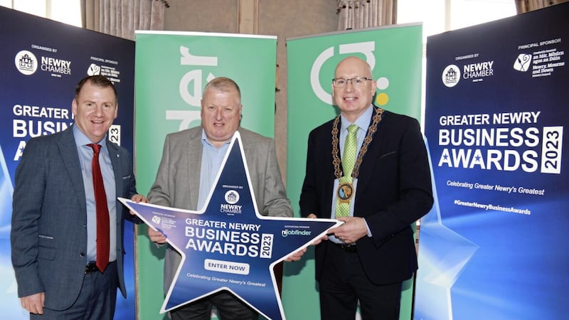 Newry Chamber chief executive Tony McKeown (left) and Newry, Mourne and Down Council chair Michael Savage (right) with Cathal Austin, centre manager at the Quays, which is sponsoring the best customer service (multiple retailer) award 