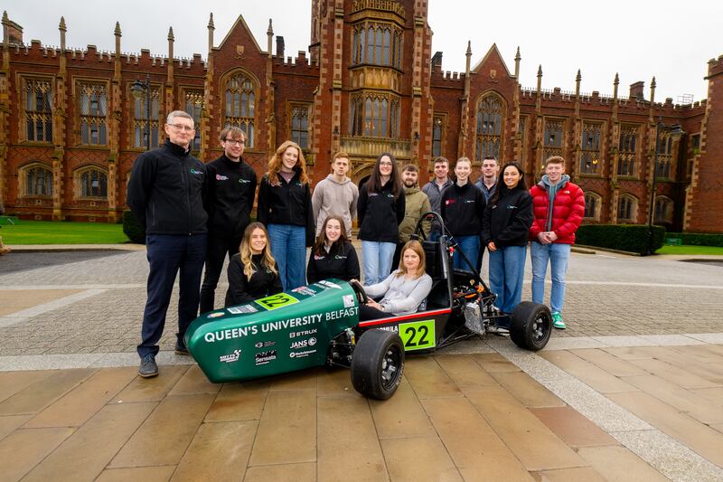 Bernie Collins pictured with from Queen’s Formula Student team. (Queen’s University Belfast)