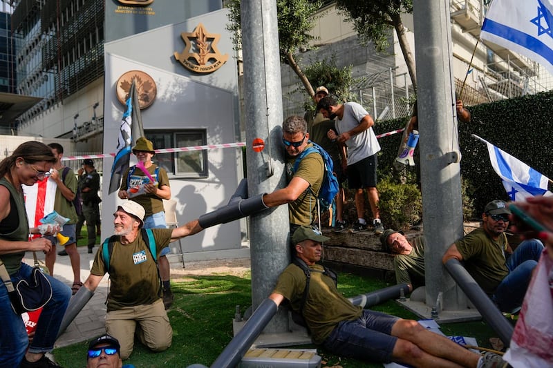 Israeli military reservists block the entrance to a military base as they protest against plans by Prime Minister Benjamin Netanyahu’s government to overhaul the judicial system