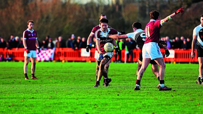 Slaughtneil&rsquo;s Chrissy McKaigue tries to escape the attentions of Cathal Og Greene of St Kiernan&rsquo;s