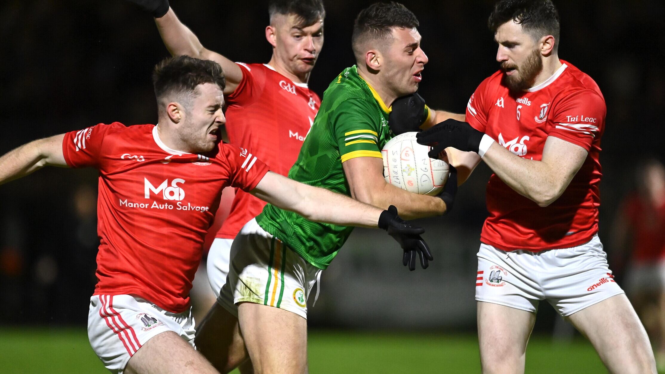Dungannon's Padraig McNulty tries to break the tackles of Trillick trio Rory Brennan, Daire Gallagher and Richie Donnelly during the Tyrone SFC semi-final which Trillick won to set up a final clash with Errigal Ciaran Picture: Oliver McVeigh