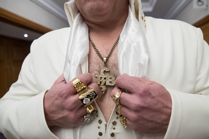 An Elvis performer shows off his jewellery