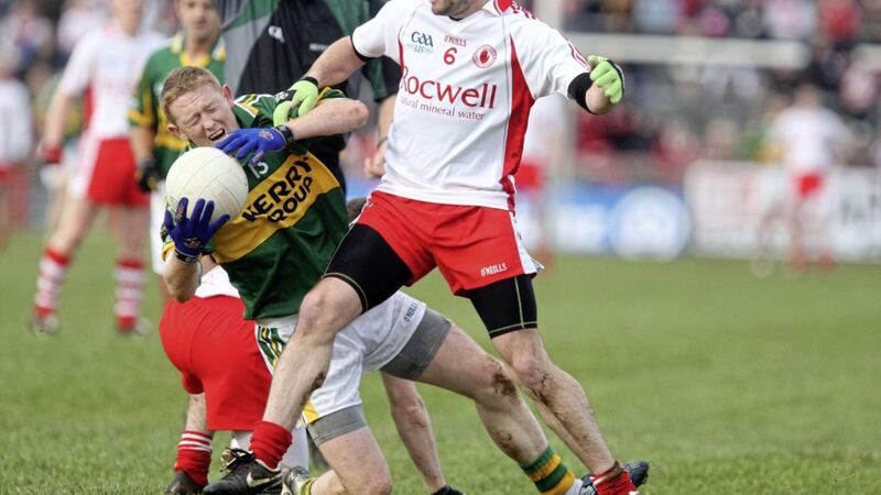Tyrone&#39;s Ryan McMenamin gets acquainted with Colm Cooper during a National League match at Healy Park in 2009. Picture by Colm O&#39;Reilly 