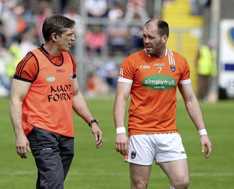 Ciaran McKeever (right), who has announced his retirement from representing Armagh, with his role model and manager Kieran McGeeney