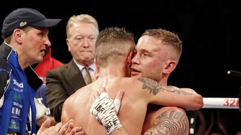 Josh Warrington (right) and Carl Frampton embrace after the World Featherweight Championship at Manchester Arena.. 