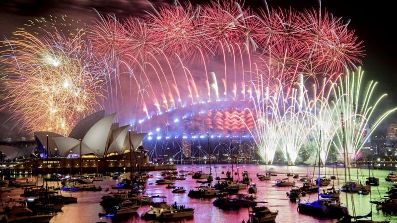 New Year&#39;s Eve celebrations have been cancelled or scaled back all over the world including Sydney in Australia where this year&#39;s fireworks display can only be watched by those who live in the area and their guests. Officials have banned people from gathering near Sydney Harbour Bridge due to the Covid-19 pandemic. Picture by Brendan Esposito/AAP via AP 