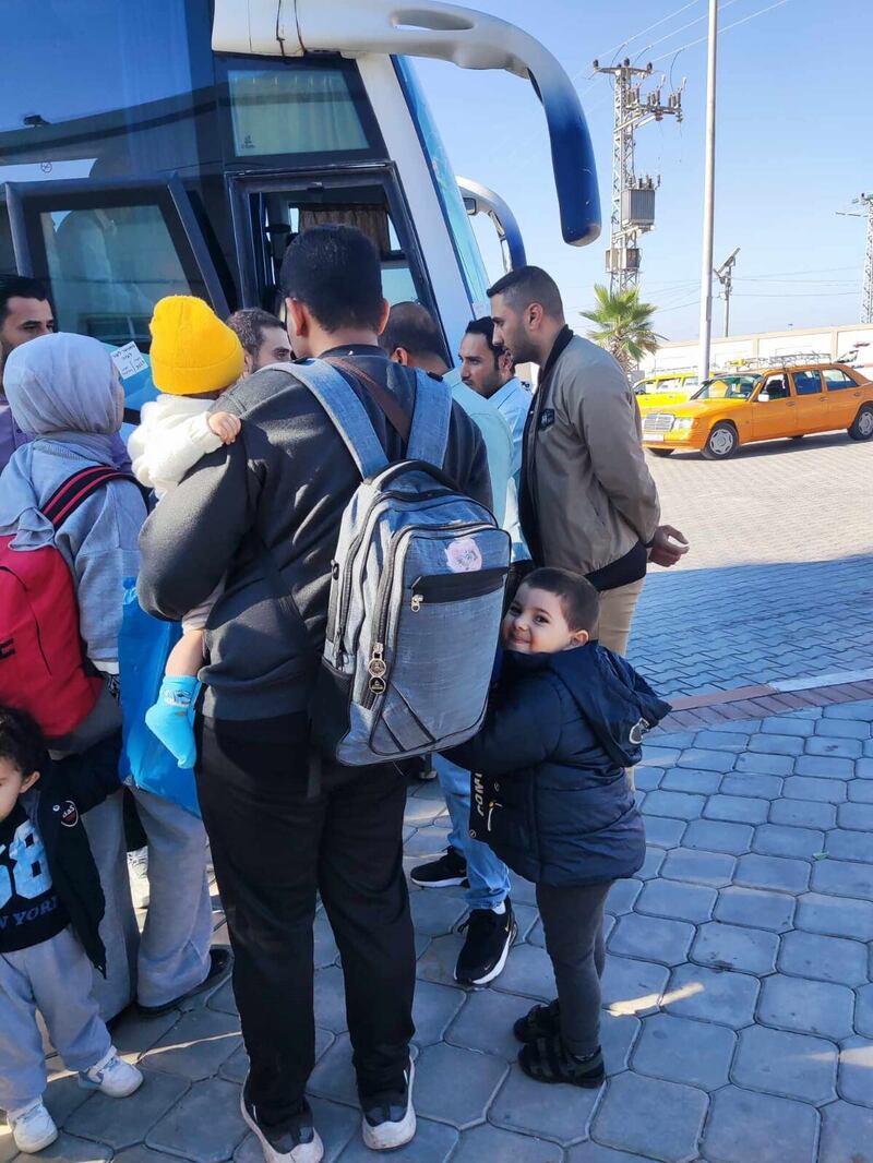 Mohammed Jendia , the brother-in-law of Belfast-born Palestinian Khalid El-Estal, crossing the border from Gaza into Egypt with Khalid's two young children Ali (4) and Sara (1).